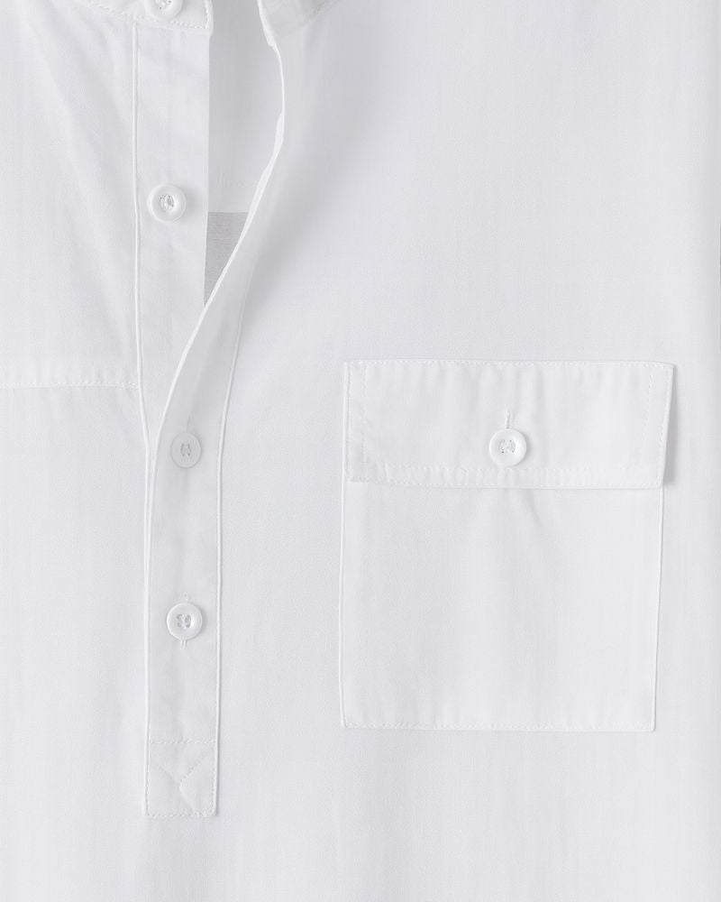 Detailed view of buttoned chest pocket and placket on men's white shirt
