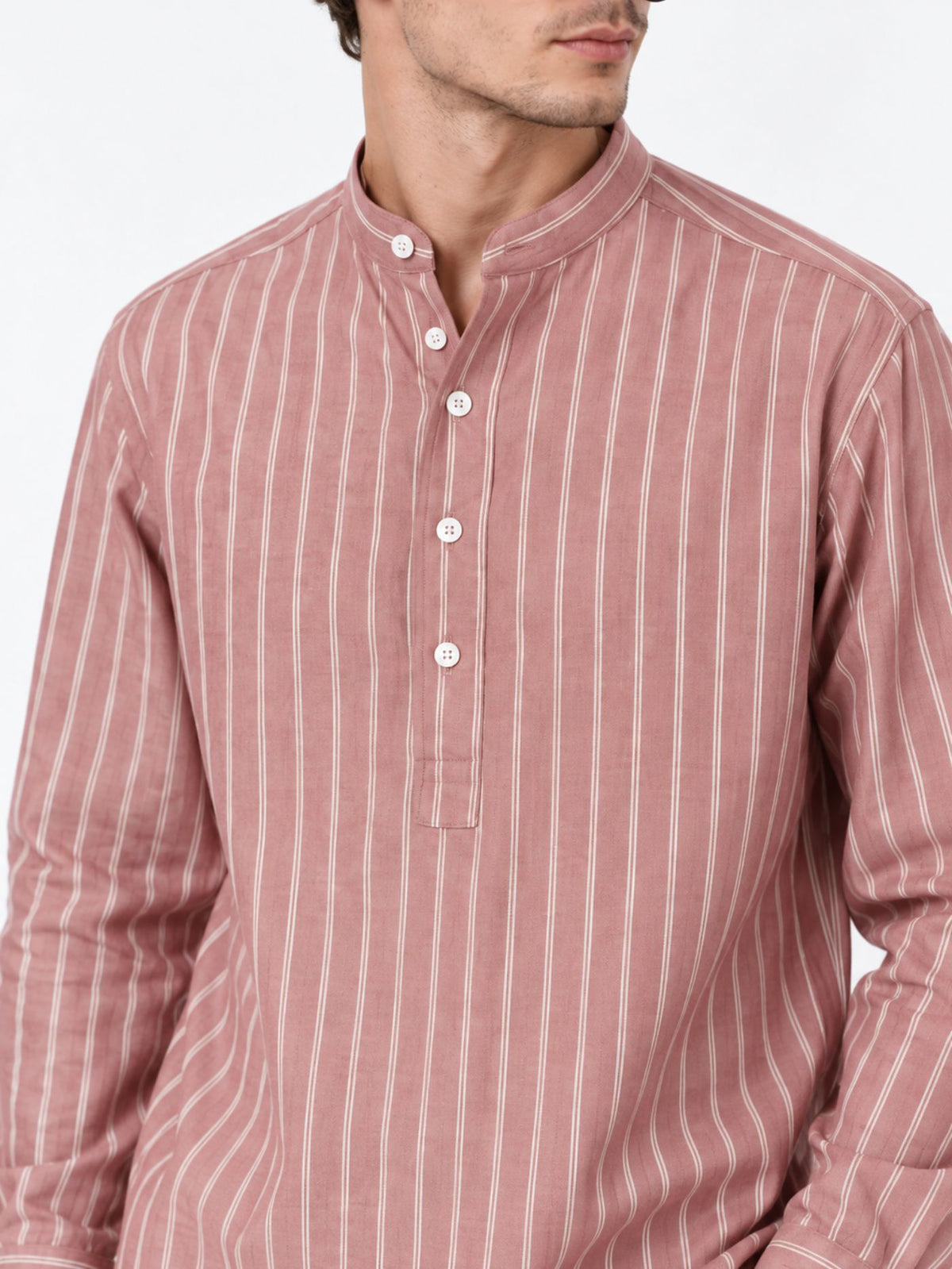 Close-up of Veer kurta shirt showing Mandarin collar, white buttons and fine ivory stripes.