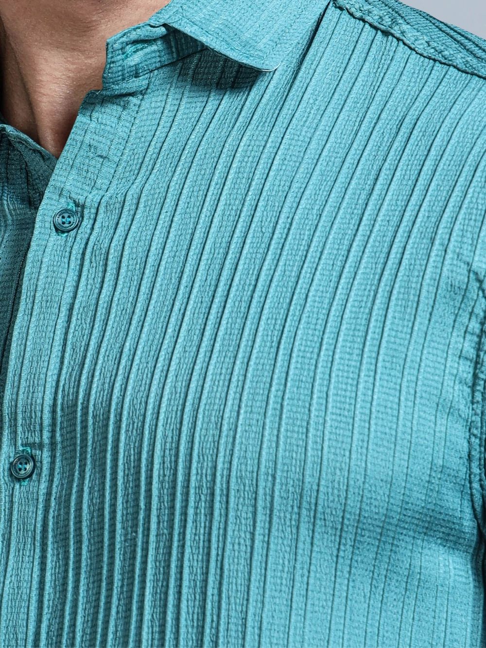 Close-up of teal green cord textured fabric