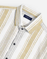 Close-up of men's vertical stripe shirt in mustard and grey showing textured cotton weave, black buttons, and collar detail with DDsol label
