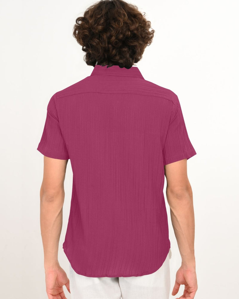 Back view of magenta textured short-sleeve shirt.