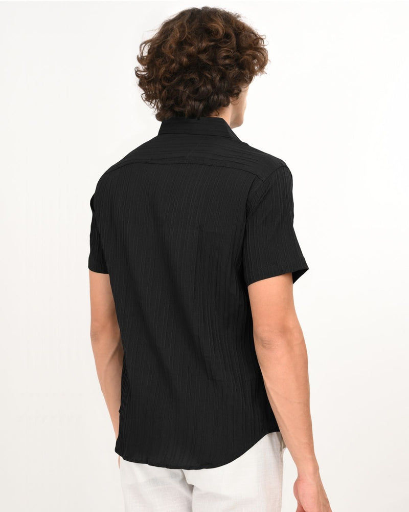 Back view of men’s black textured short-sleeve shirt