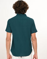 Back view of teal green textured short-sleeve men’s shirt