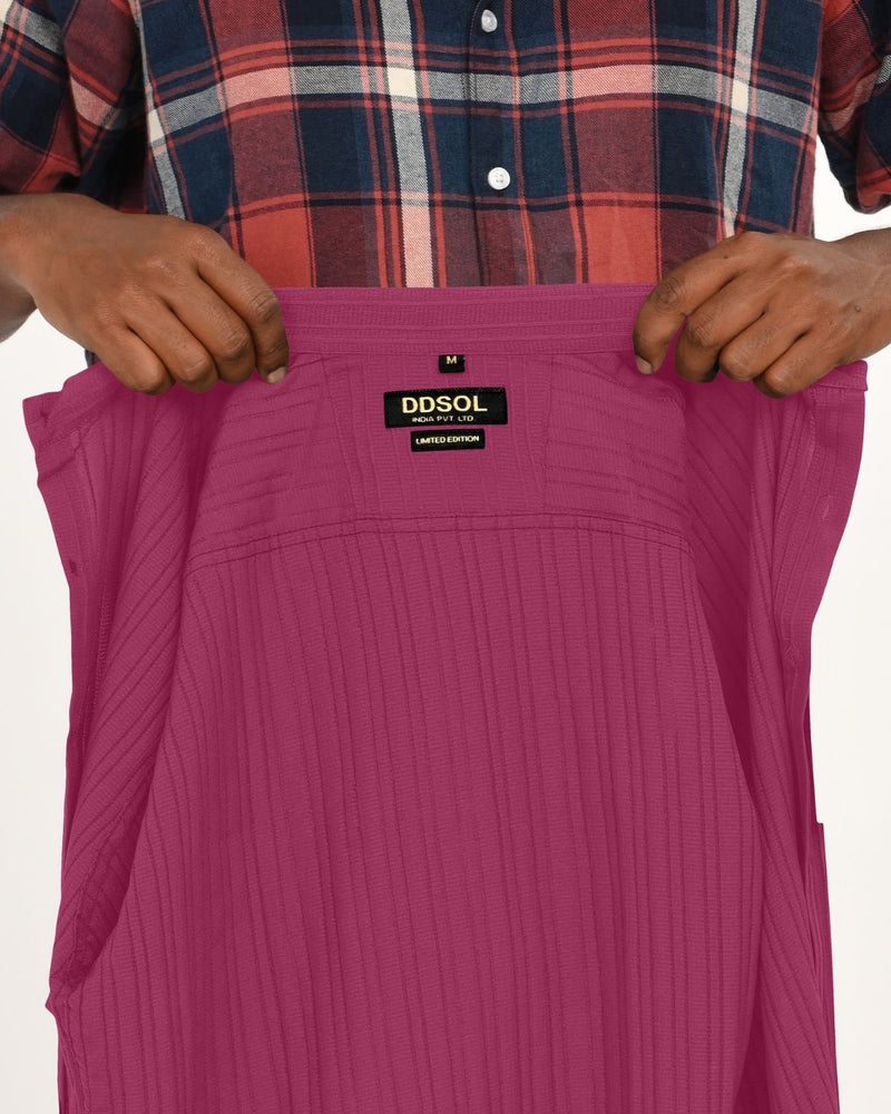 Close-up of DDSOL label inside magenta shirt.