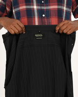 Close-up of black textured short-sleeve shirt label DDSOL Limited Edition