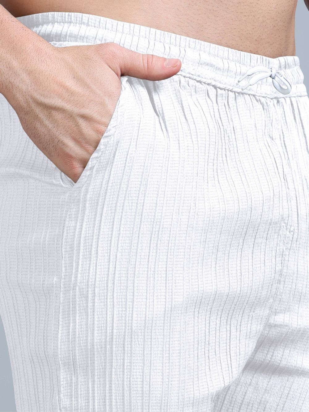 Close-up of ivory white cord pants with pocket