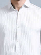 Close-up of ivory white cord shirt buttons