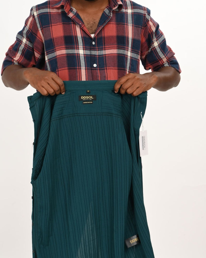 Close-up of teal green textured shirt fabric and label