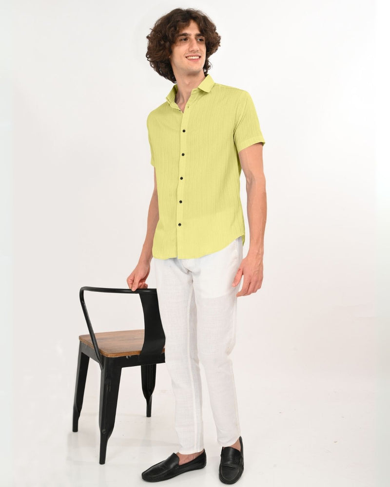 Close up lime green textured fabric shirt