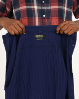 Label close-up of navy blue textured short-sleeve shirt