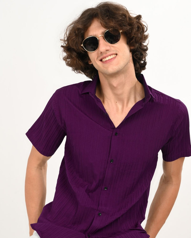 Man smiling in Royal Plum textured short-sleeve shirt