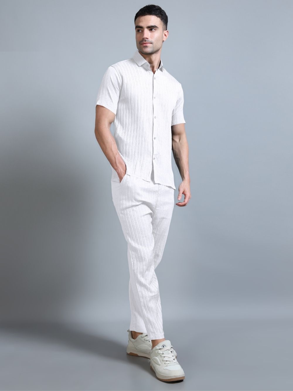 Men’s ivory white cord set walking pose