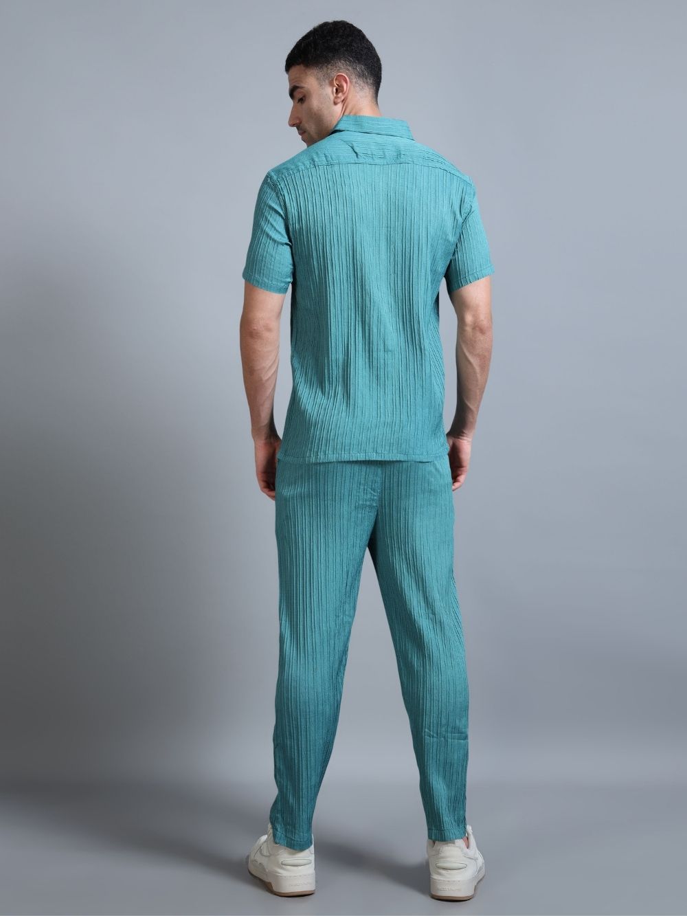 Men’s teal green cord set back view