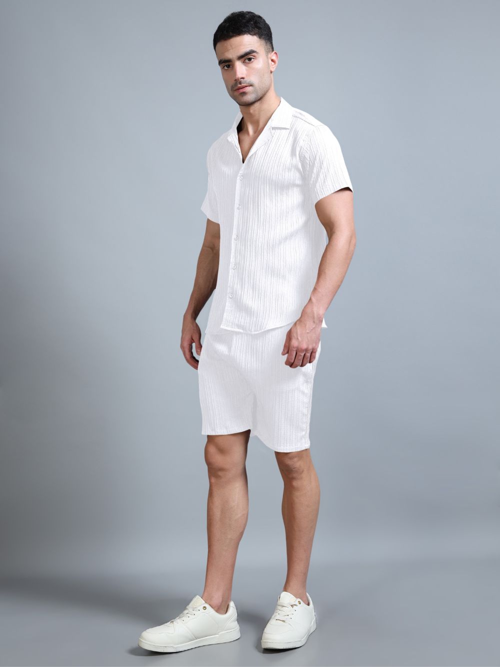Men’s white co-ord set with shirt and shorts, side angle