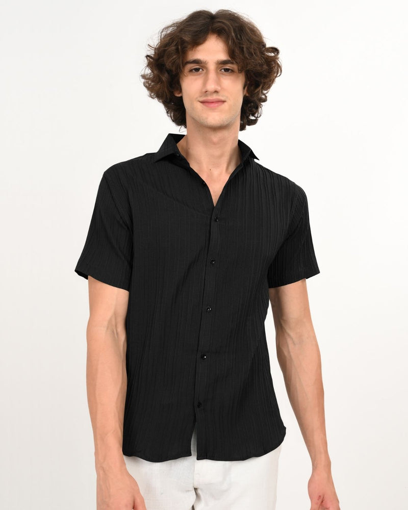 Profile view of black textured short-sleeve men’s shirt