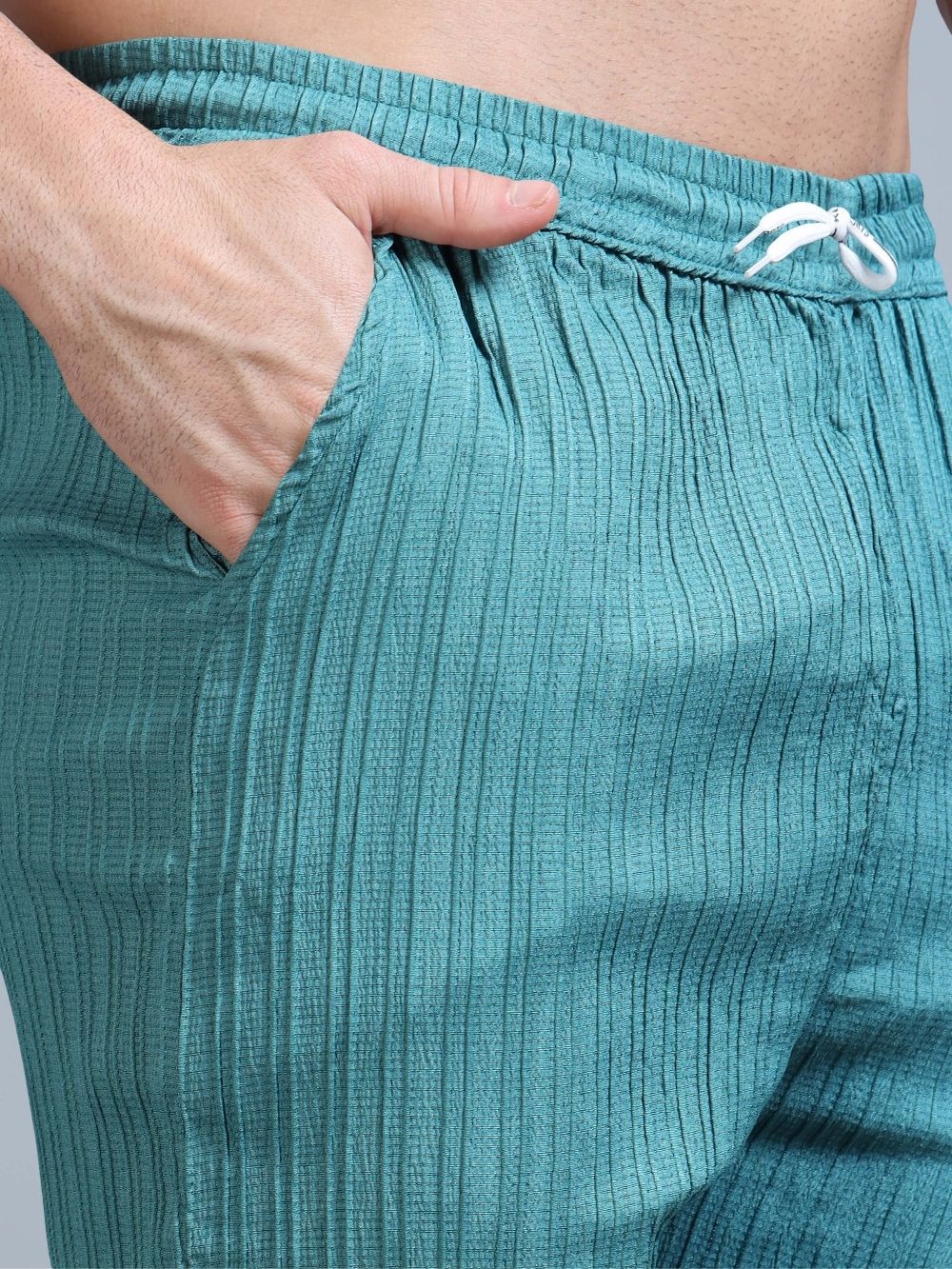 Teal green cord pants with drawstring waistband