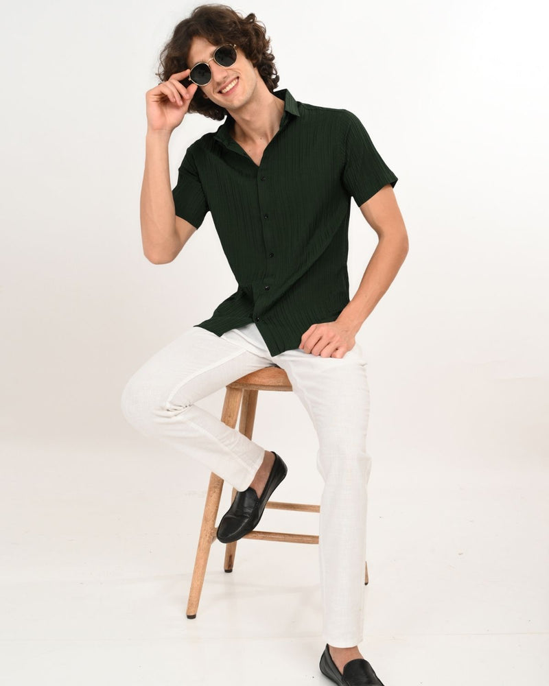 dark green textured short-sleeve shirt.