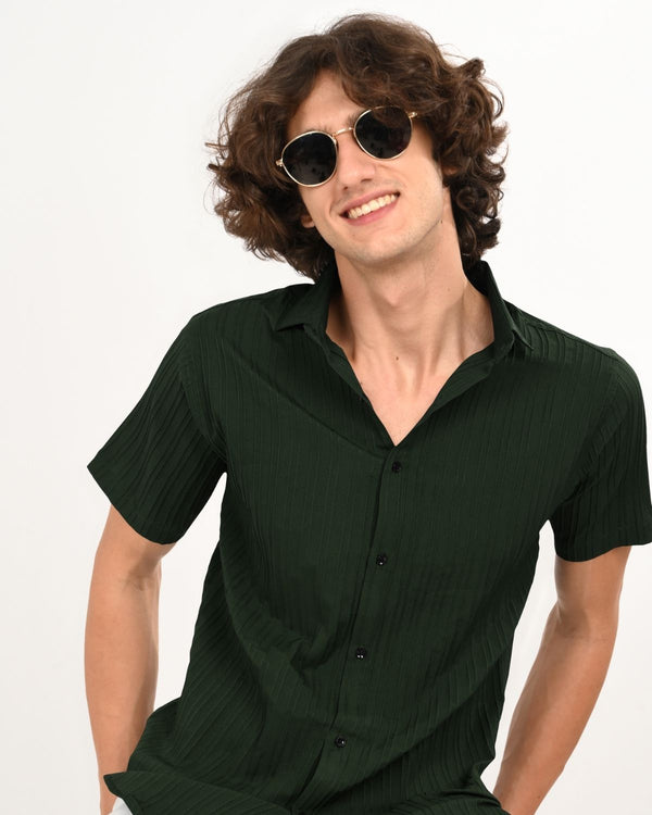dark green textured short-sleeve shirt and sunglasse